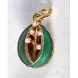 A Silver Gilt, Enamel and Pearl Egg Pendant. Stamped 84, 2.2 cm x 1.5 cm, weight 6.6g