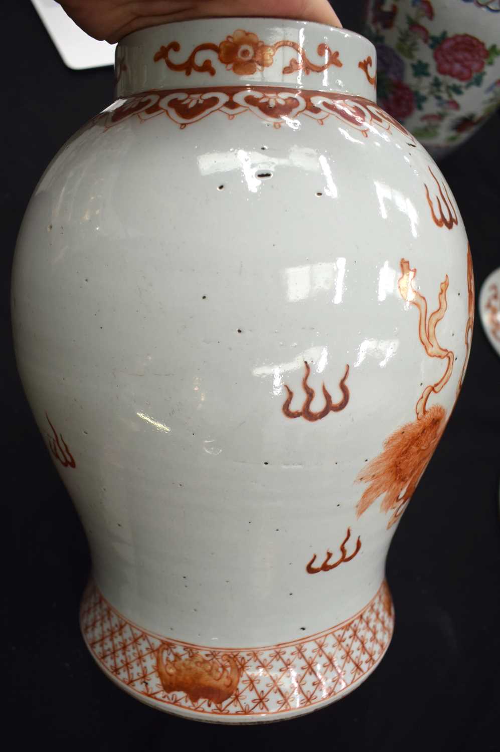 A LARGE PAIR OF CHINESE QING DYNASTY IRON RED PAINTED GINGER JARS AND COVERS painted with buddhistic - Image 17 of 26