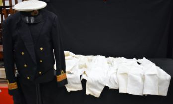 A Royal Navy dress uniform together with a cap and a selection of trousers, shirts,collars etc (