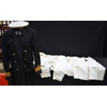 A Royal Navy dress uniform together with a cap and a selection of trousers, shirts,collars etc (