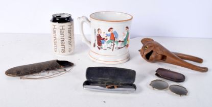 A 19th Century Toad mug together with a carved wood Cat nutcracker and a collection of cased antique