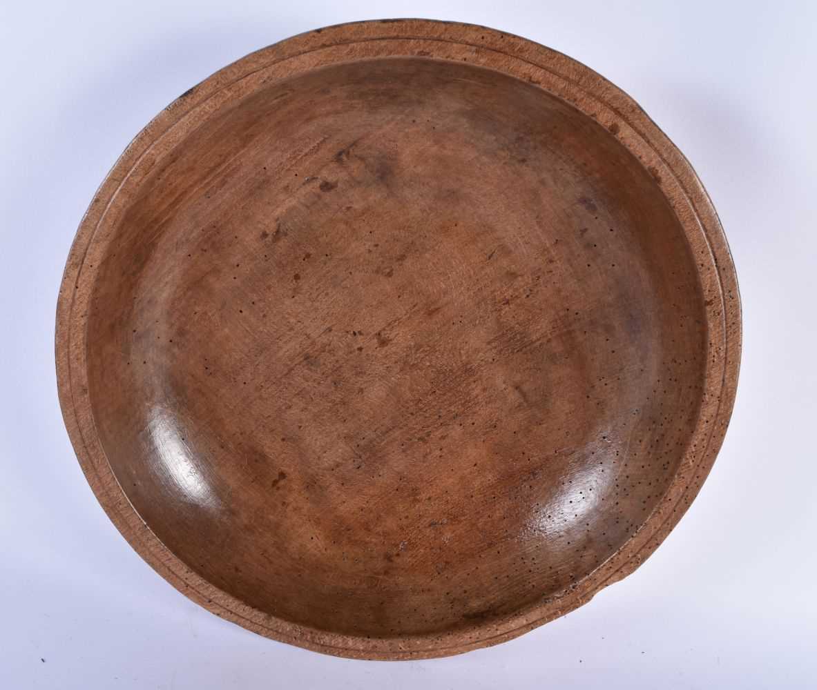 A CARVED DAIRY WOOD TREEN BUTTER BOWL AND SPOON. Bowl 40 cm diameter. (2) - Image 2 of 7