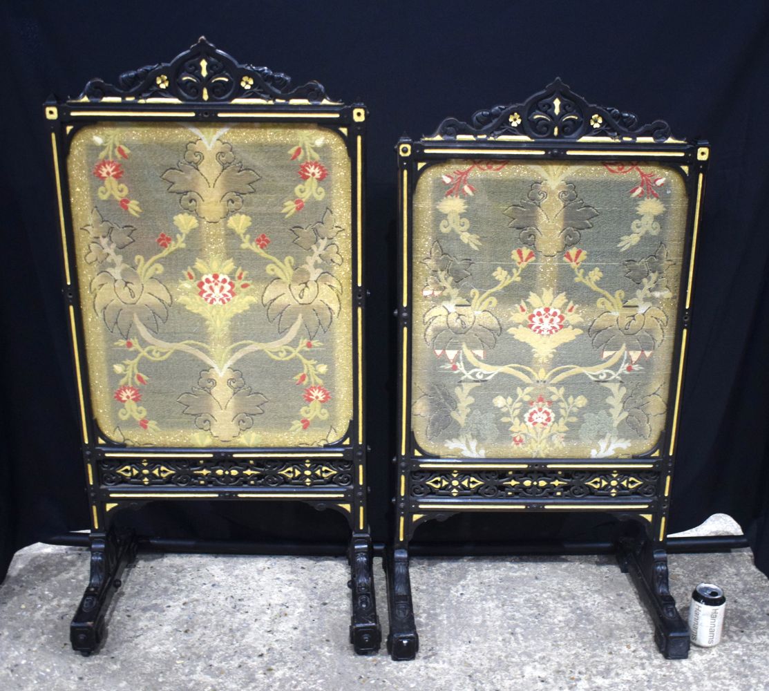 A near pair of wooden framed firescreens with glazed embroidered panels 114 cm (2).
