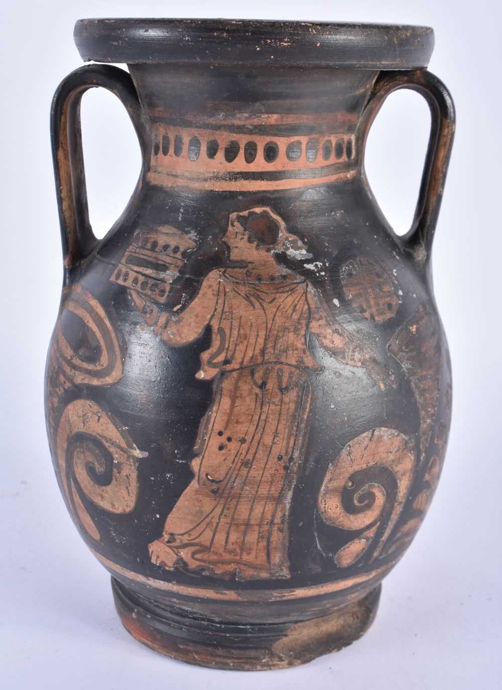 AN EARLY SOUTHERN EUROPEAN ATTIC TYPE TWIN HANDLED POTTERY VASE painted with figures. 22 cm x 12