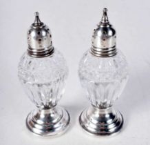 Two Glass Condiments with Silver Mounts. Stamped Sterling. 9.5 cm x 3.6 cm, Weighted bases
