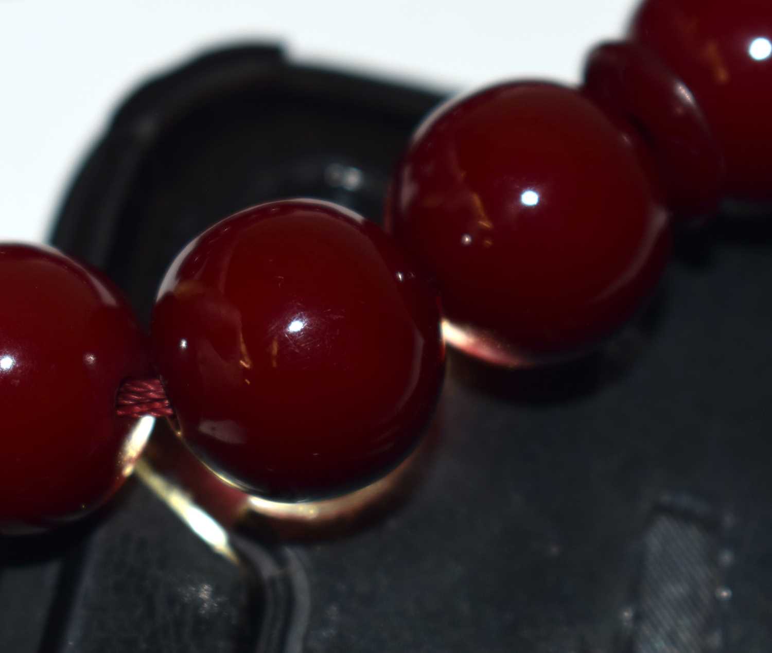 A TURKISH CHERRY AMBER TYPE TESBIH NECKLACE. 93 grams. 94 cm long. - Image 4 of 4