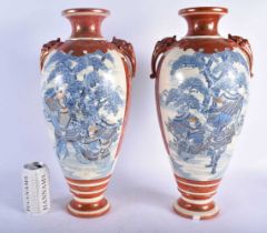 A LARGE PAIR OF 19TH CENTURY JAPANESE MEIJI PERIOD SATSUMA VASES painted with figures within