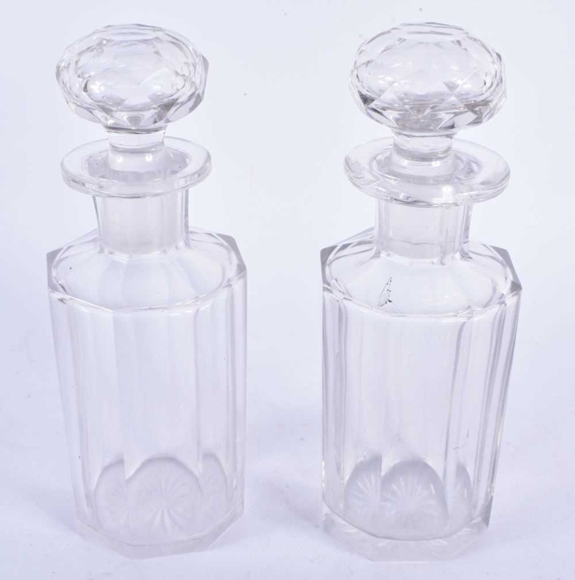 A Pair of Cut Glass Decanters. 18cm x 6.5cm,