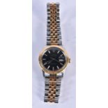 A GOLD AND STAINLESS STEEL BLACK DIAL WRISTWATCH. 3.75 cm wide inc crown.