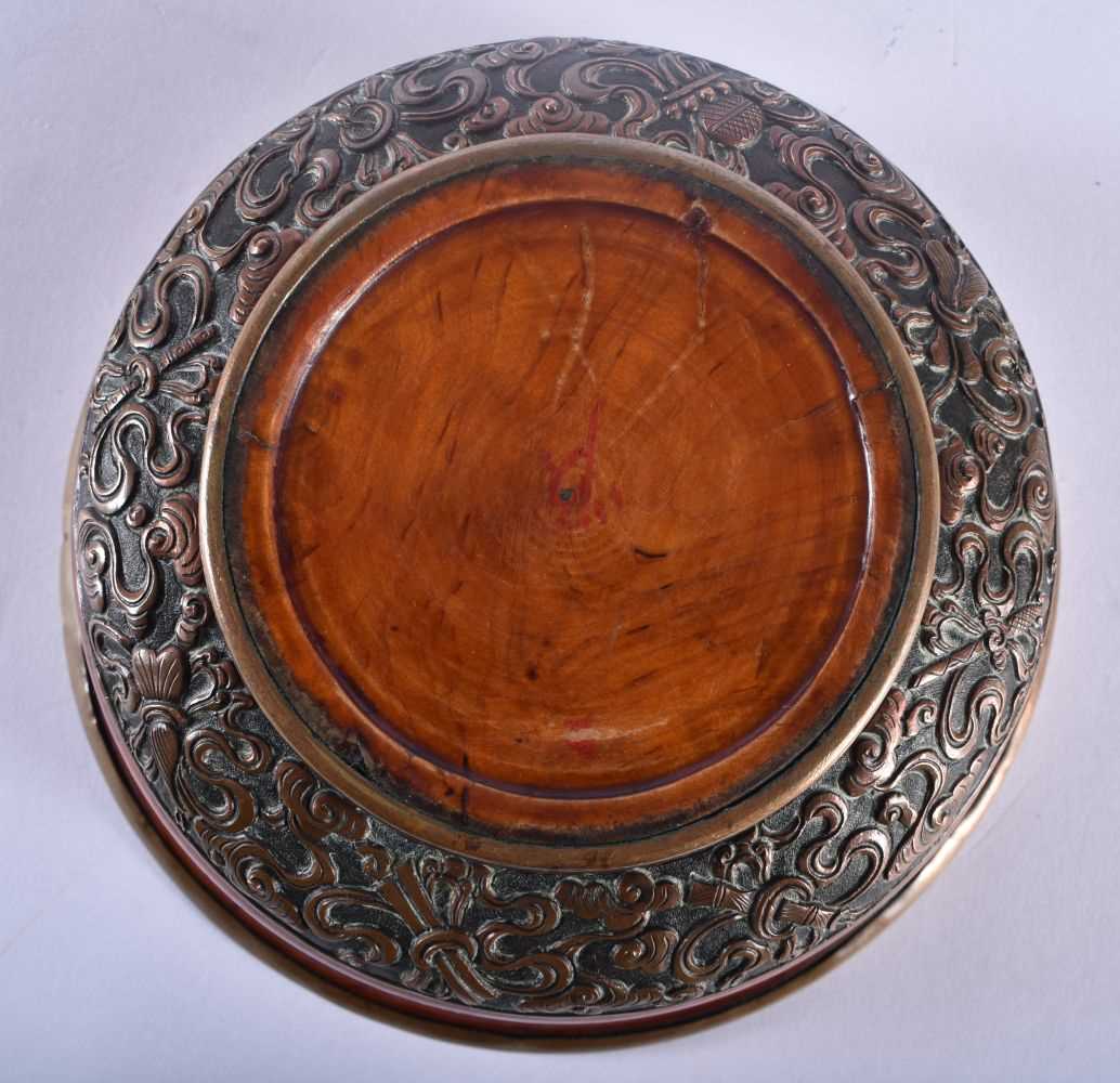 A 19TH CENTURY TIBETAN CARVED WOOD AND COPPER REPOUSSE BOWL decorated with foliage. 12 cm wide. - Image 4 of 4