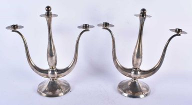 A Pair of Eugen Ferner Silver Plated Candlesticks. 30cm x 30cm x 12cm (2)