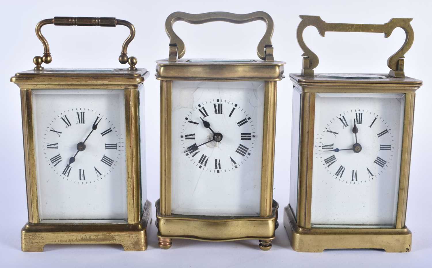 THREE ANTIQUE FRENCH BRASS CARRIAGE CLOCKS 14.25cm high inc handle. (3)