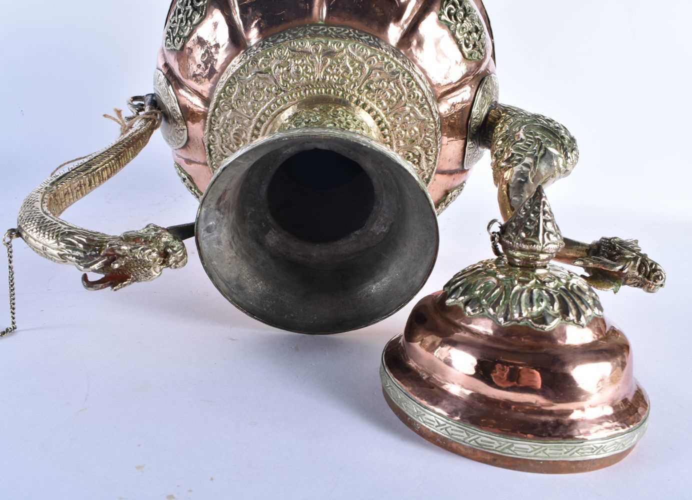 A LARGE 19TH CENTURY TIBETAN REPOUSSE WHITE METAL AND COPPER EWER decorated with dragons and - Image 7 of 8