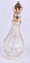 AN ANTIQUE 18CT GOLD MOUNTED GLASS SCENT BOTTLE. 46 grams. 10.5 cm x 3.75 cm.