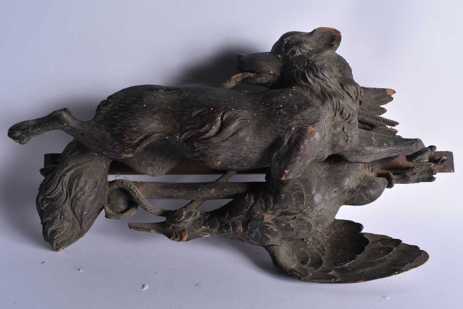 A LARGE 19TH CENTURY BAVARIAN BLACK FOREST CARVED WOOD FOX AND BIRD PANEL. 45cm x 27 cm.