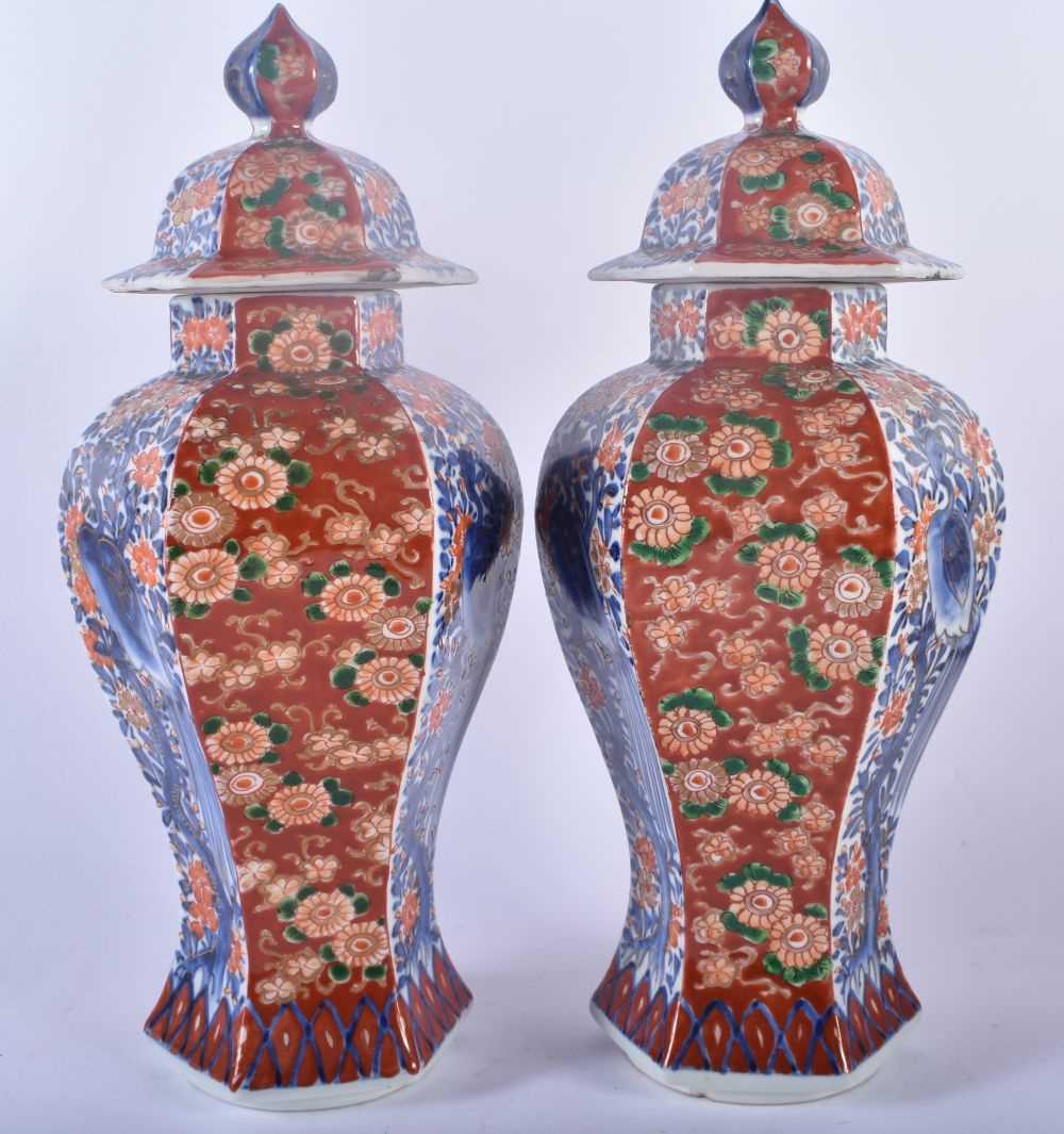 A PAIR OF 19TH CENTURY JAPANESE MEIJI PERIOD IMARI VASES AND COVERS painted with flowers, birds - Image 2 of 5