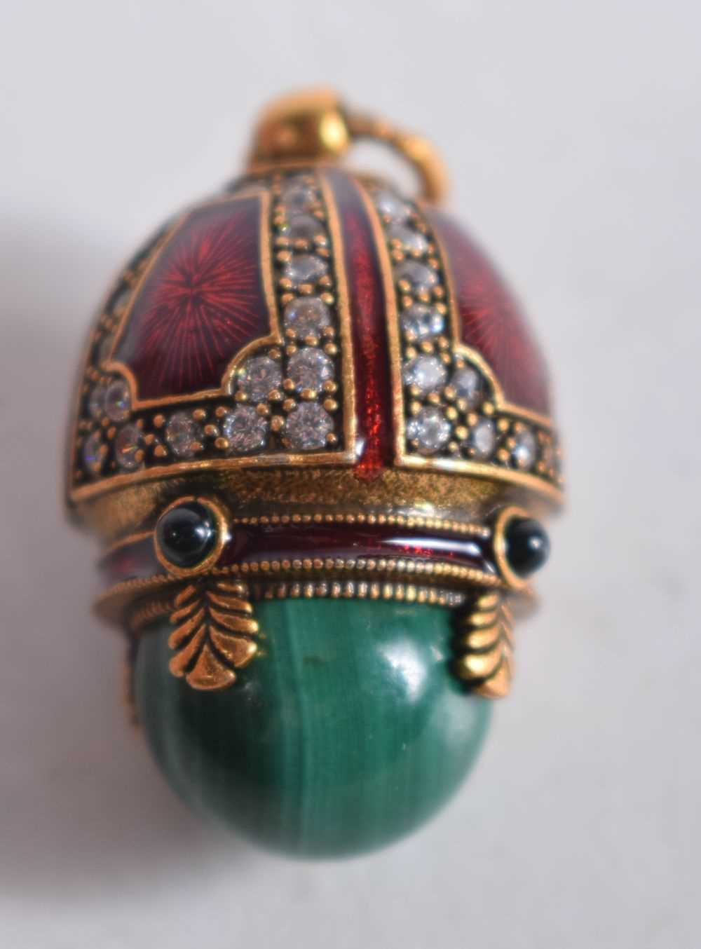 A Continental Silver Gilt, Enamel and Malachite Egg Pendant. Stamped 84, 2.6 cm x 1.7cm, weight 10. - Image 2 of 11