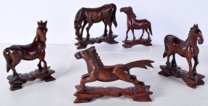 A collection of Chinese carved hardwood horses largest 12 x 10 cm.(5).