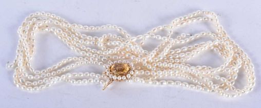 A Six Strand Pearl Necklace with a 14 Carat Gold and Citrine Clasp. 43cm long, weight 58.21g