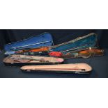 A collection of cased Violins including A Stradivarius copy (3).