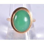 A High Carat Gold Ring with a Jade Cabochon. Size R, weight 6.8g