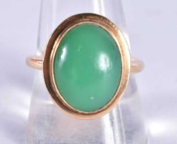A High Carat Gold Ring with a Jade Cabochon. Size R, weight 6.8g