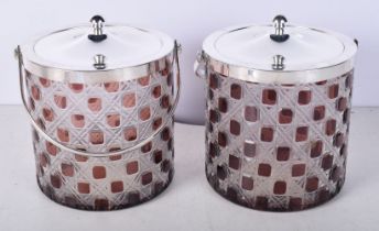 A pair of silver plated and glass biscuit barrels 15 cm (2).