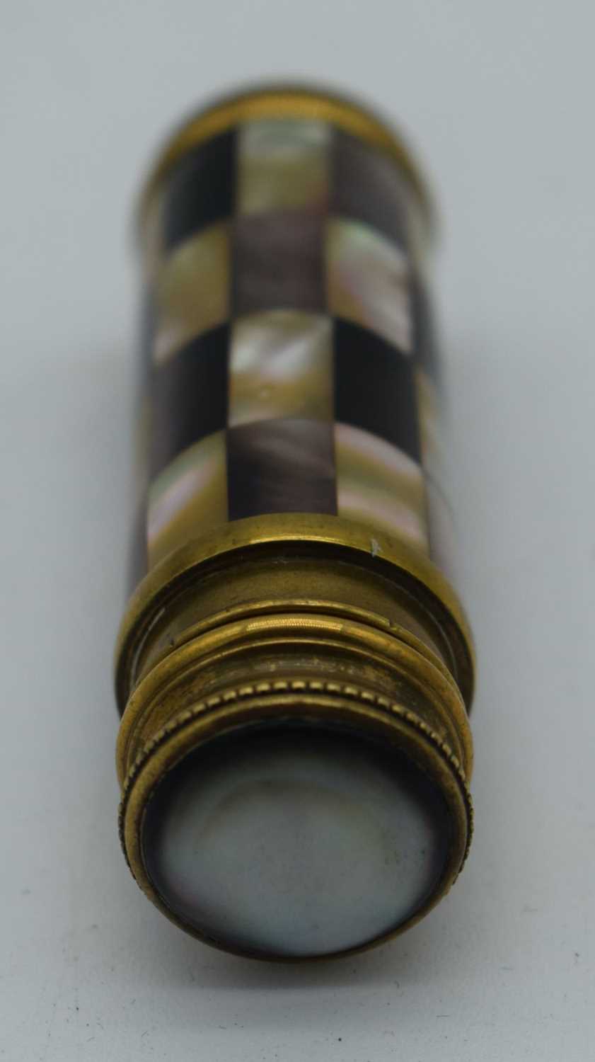 AN ANTIQUE MOTHER OF PEARL SPRINGING SCENT BOTTLE. 53 grams. 10 cm x 2 cm extended. - Image 3 of 3
