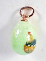 A Continental Enamel Egg Pendant with Gold Mounts. Stamped 56. 1.9cm x 1.2 cm, weight 2.9g