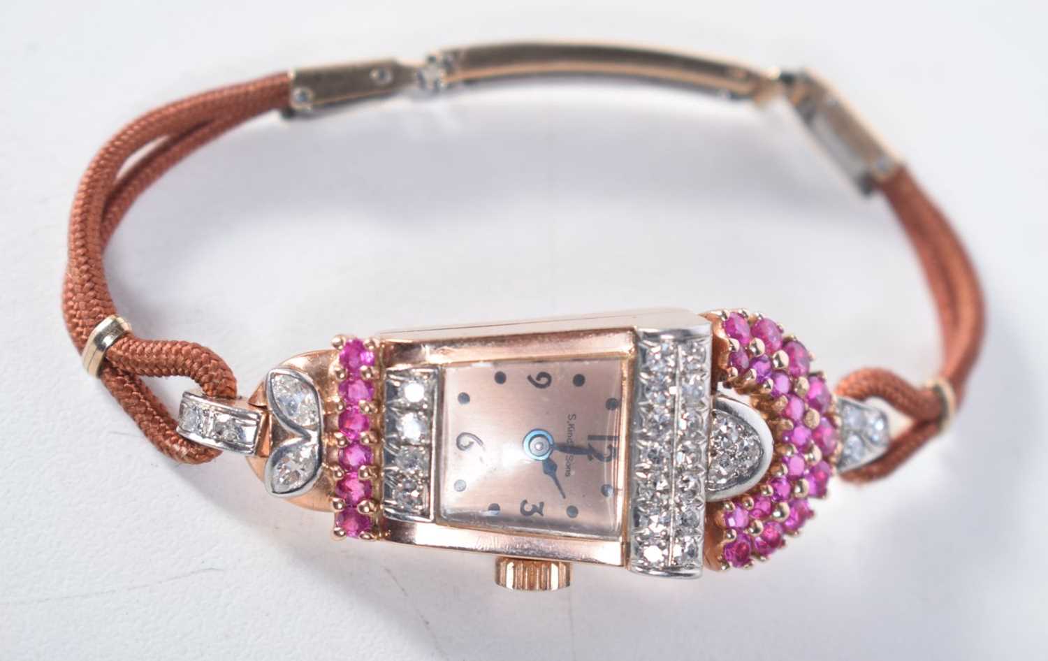 A VINTAGE GOLD DIAMOND AND RUBY COCKTAIL WATCH. 17.1 grams. 1.75 cm wide inc crown.