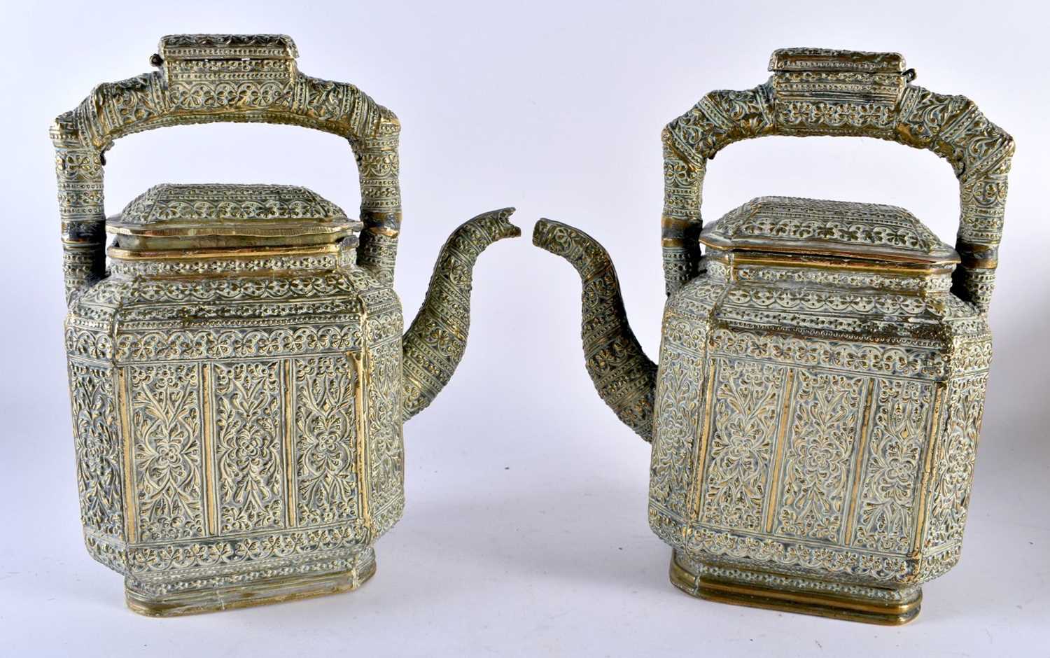 A LARGE PAIR OF 19TH CENTURY INDIAN BRONZE TEAPOTS AND COVERS decorated with floral sprays and - Image 3 of 6