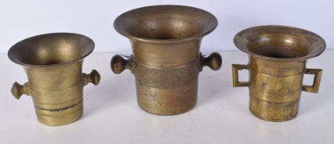 A collection of antique bronze Mortars 12.5 x 14 cm.(3).
