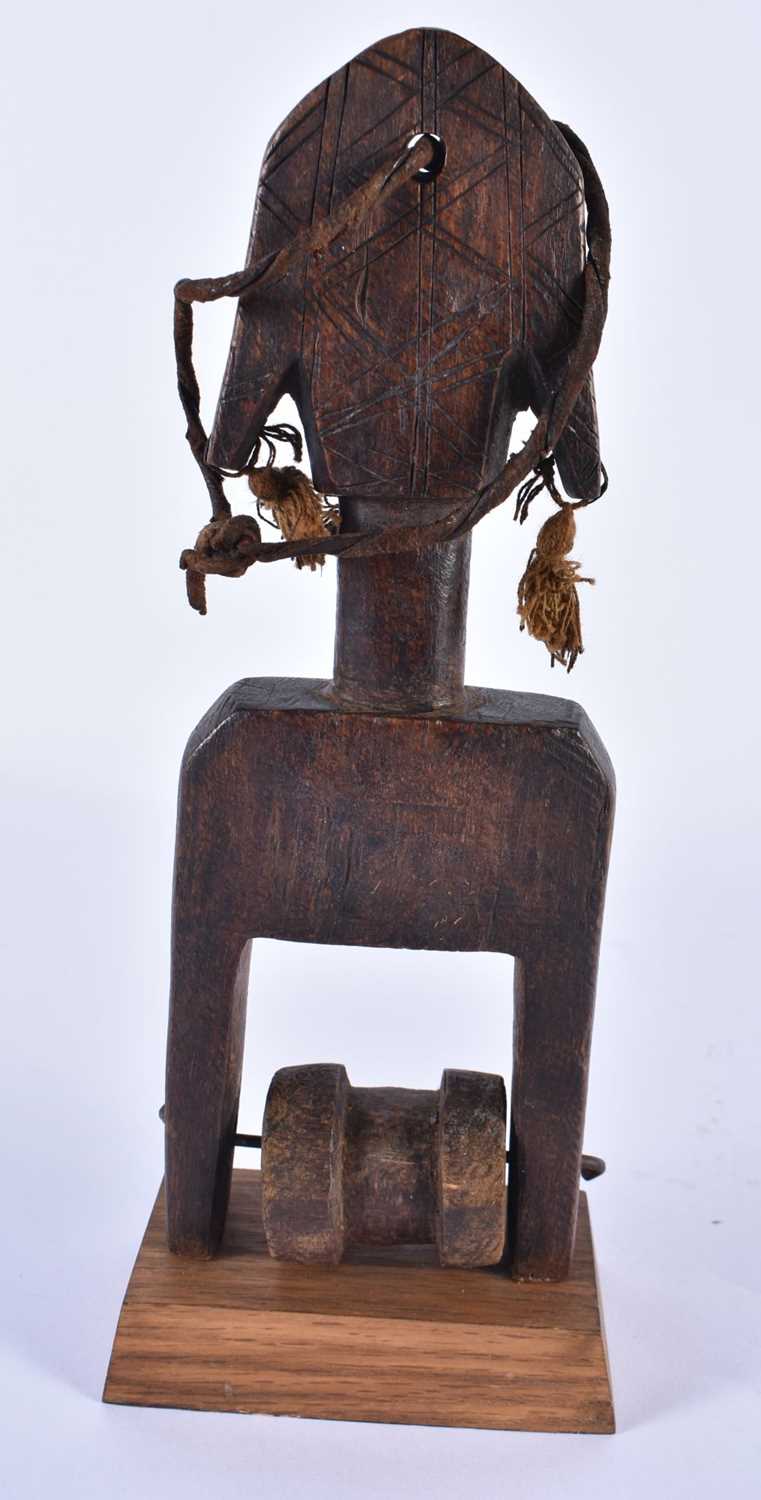 A TRIBAL CARVED WOOD AFRICAN PULLEY. 24 cm high. - Image 4 of 5