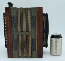 A German Made Accordion 14 x 26 x 26cm