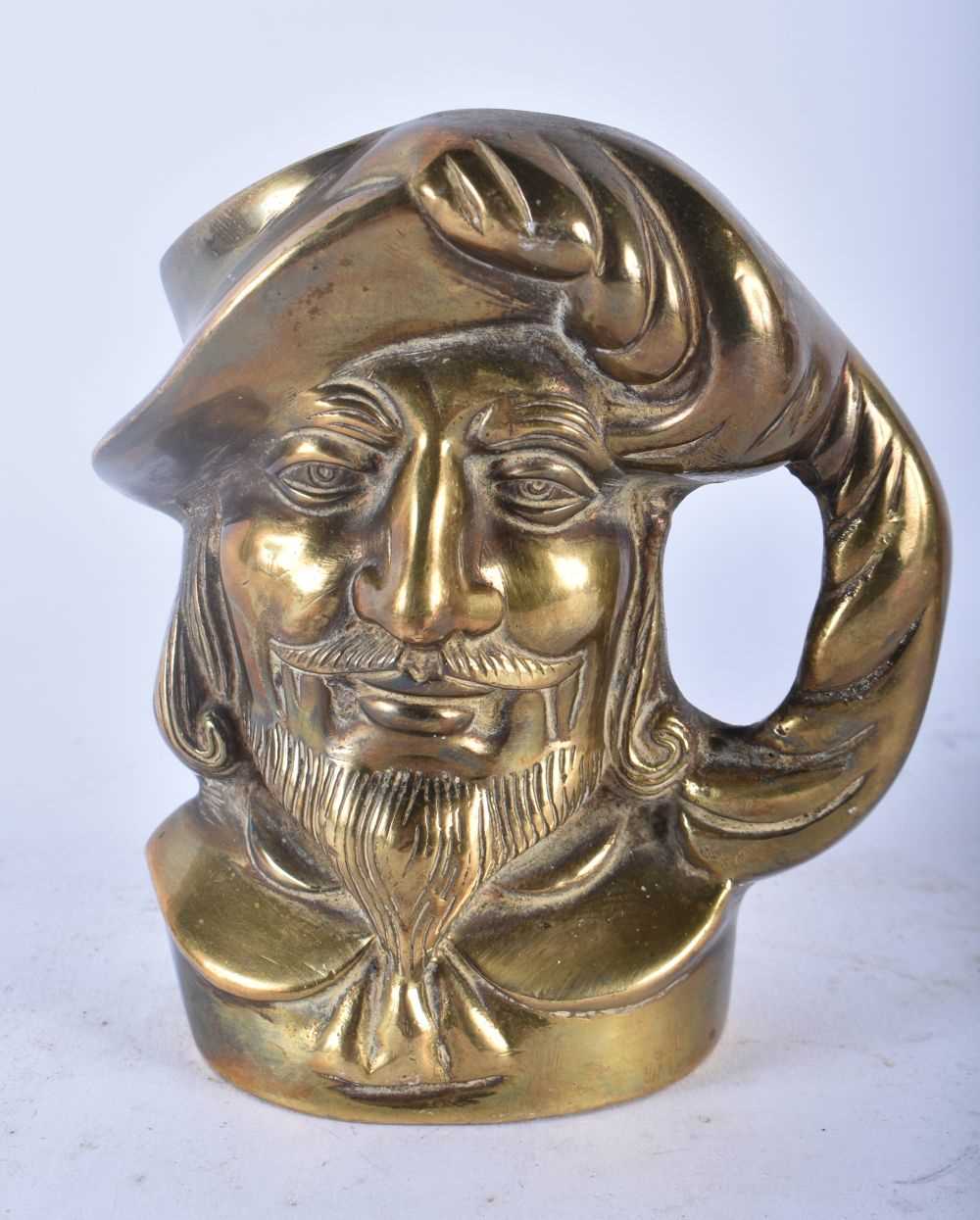 A RARE PAIR OF 19TH CENTURY ENGLISH BRONZE CHARACTER JUGS modelled as male and pirate. 11cm x 9 cm. - Image 2 of 5