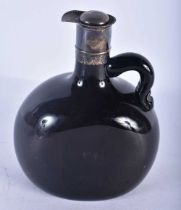 AN ANTIQUE SILVER PLATED AND DARK GLASS JUG. 17 cm x 12 cm.