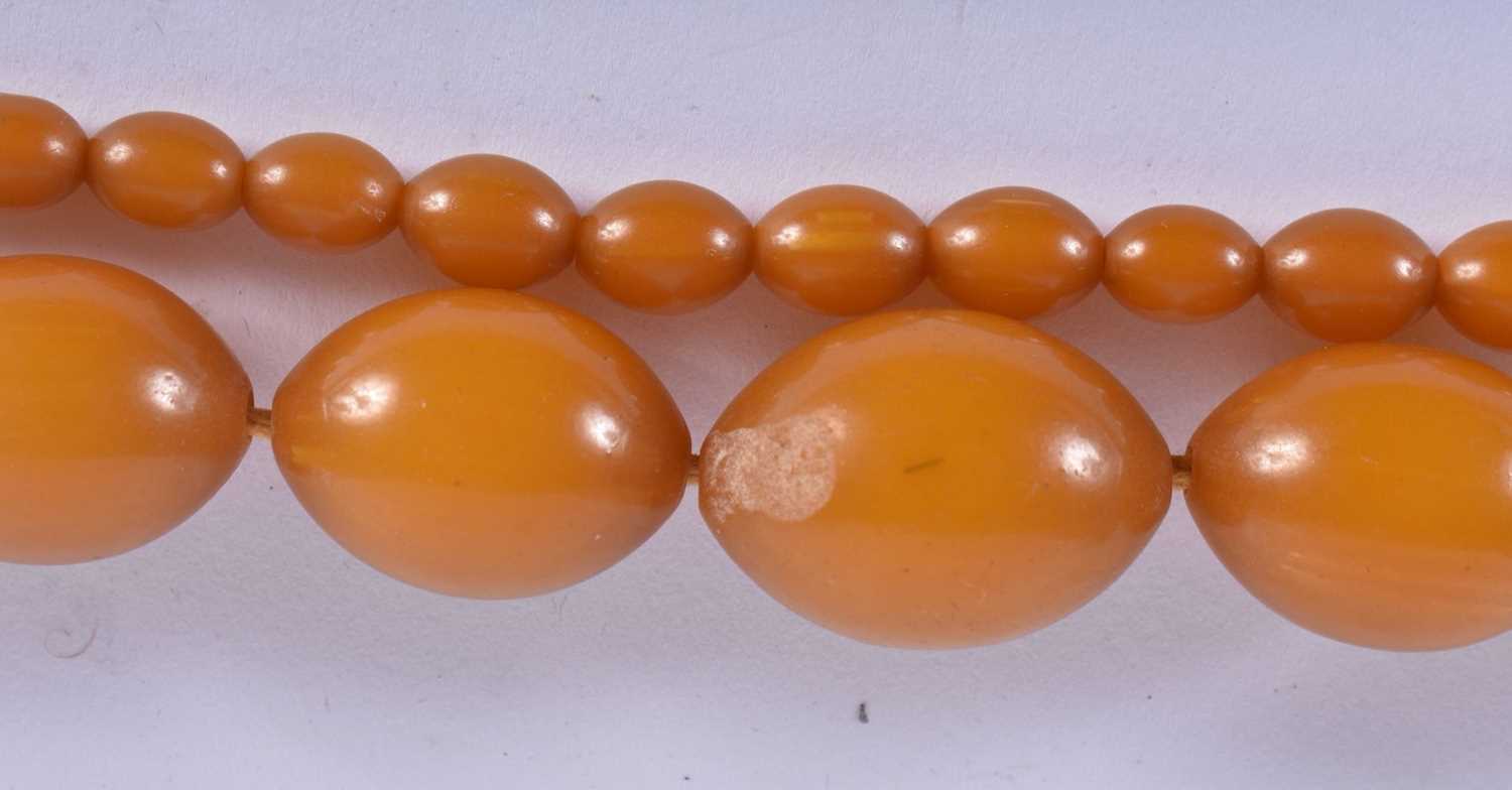 FOUR VINTAGE AMBER TYPE NECKLACES. 183 grams. Largest 88 cm long. (4) - Image 2 of 5