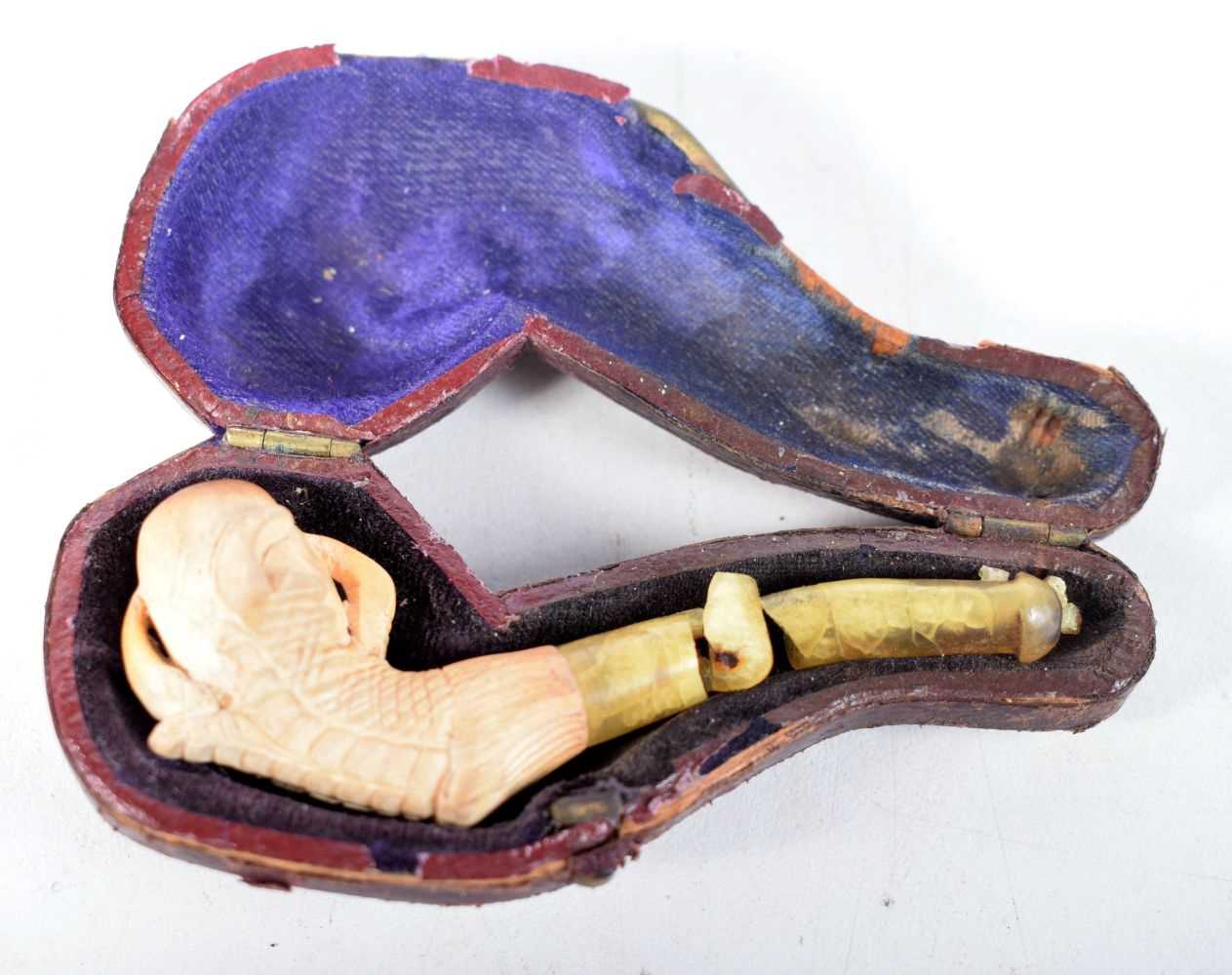 An Antique Cased Meerschaum Pipe, Bowl carved as a Claw with damaged Stem. Case 8.5 cm x 3.6 cm