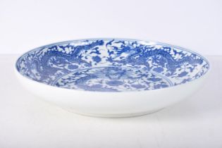 A Chinese porcelain blue and white Dragon dish 33 x 6 cm .