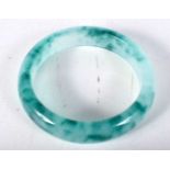 A Two Tone Green Jade Bangle. 5.9cm internal diameter, weight 57.2g