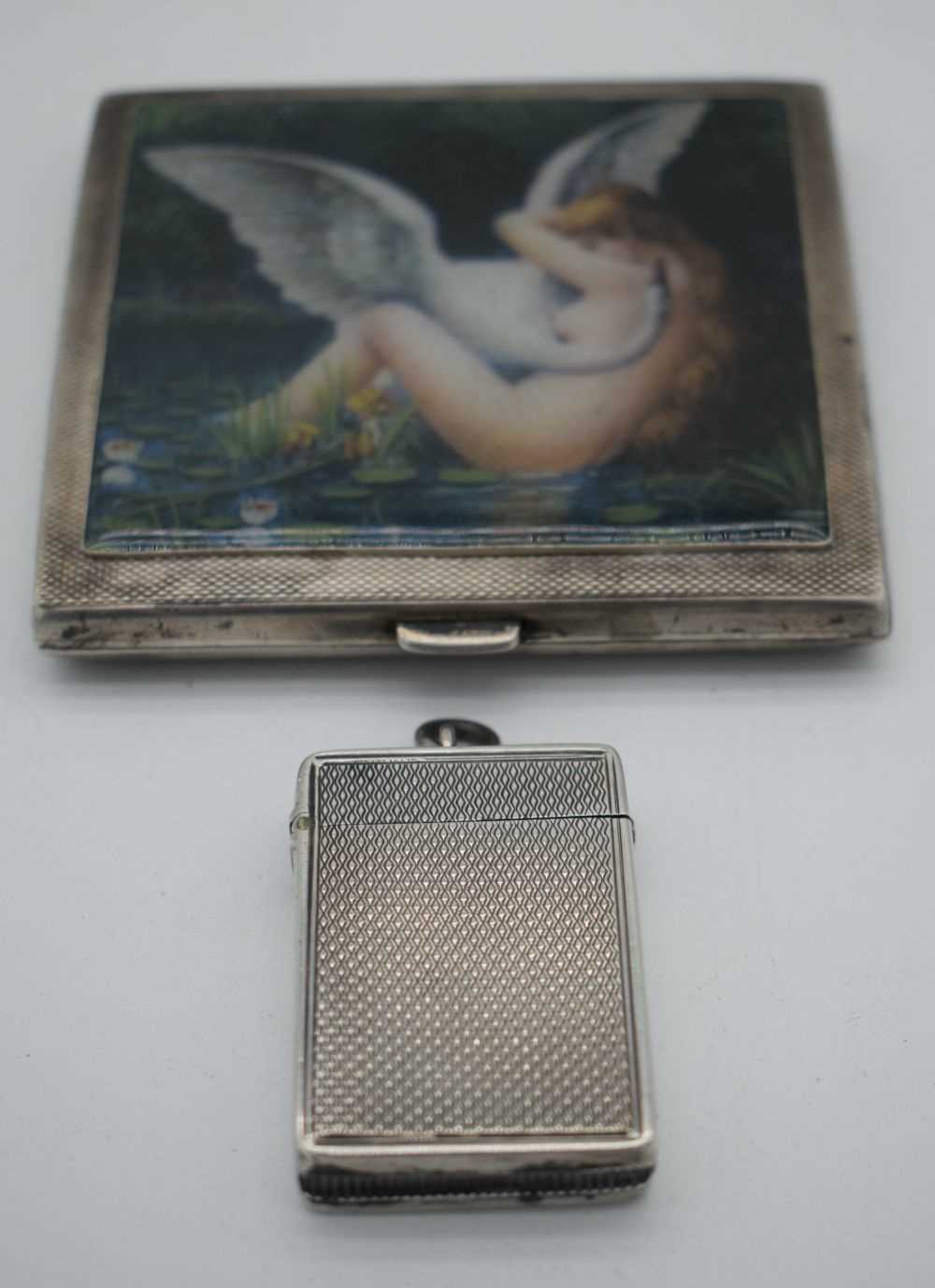 AN ANTIQUE SILVER VESTA CASE together with a silver cigarette case. Birmingham 1882 & 1932. 170