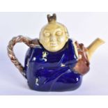 AN ANTIQUE MAJOLICA TEAPOT AND COVER formed as a Chinaman. 19 cm wide.