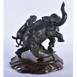 A 19TH CENTURY JAPANESE MEIJI PERIOD BRONZE OKIMONO modelled as an elephant being attacked by