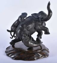 A 19TH CENTURY JAPANESE MEIJI PERIOD BRONZE OKIMONO modelled as an elephant being attacked by