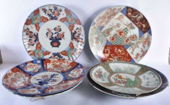 A SET OF SIX LARGE 19TH CENTURY JAPANESE MEIJI PERIOD IMARI CHARGERS of varying designs. Largest