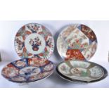 A SET OF SIX LARGE 19TH CENTURY JAPANESE MEIJI PERIOD IMARI CHARGERS of varying designs. Largest