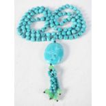 A Turquoise and Jade Pendant Necklace. Length 90cm, weight 87g