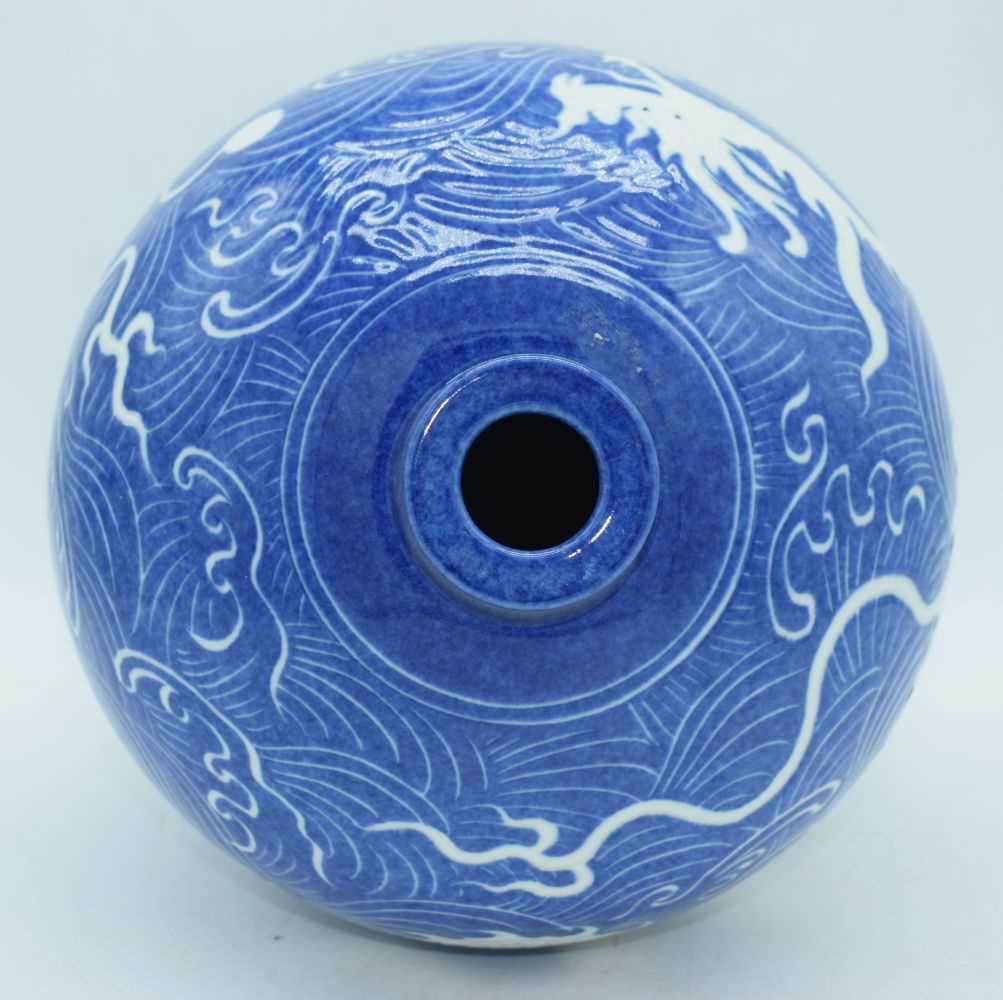 A Chinese porcelain Meiping vase decorated with a Dragon and cloud pattern in relief 37 cm. - Image 4 of 8