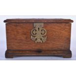 AN ART NOUVEAU COPPER INSET OAK TEA CADDY decorated in relief with a scrolling plaque depicting
