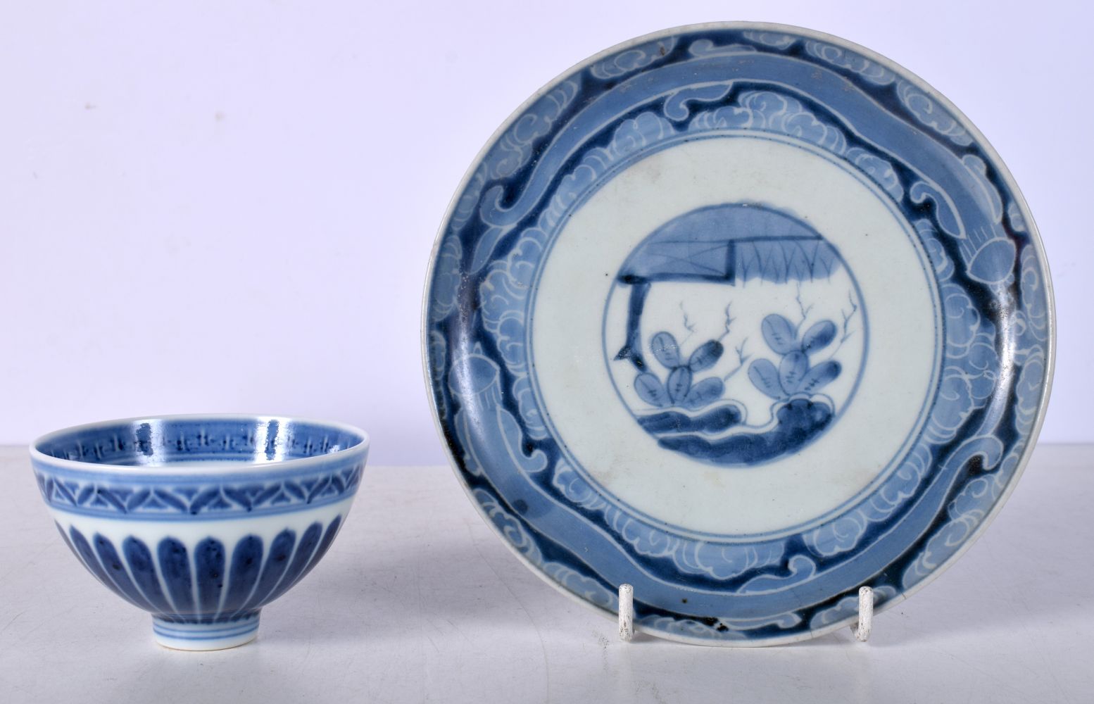 A Chinese porcelain blue and white Tea bowl together with a plate 18cm (2).